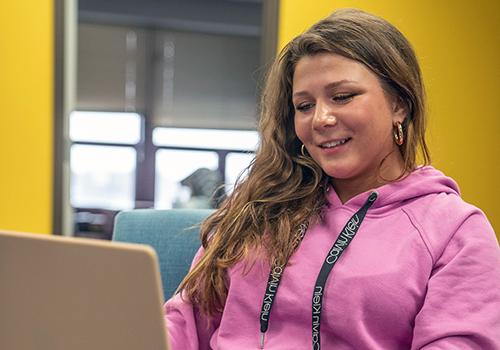 Female student looking at her laptop